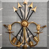 D22. Pair of brass and bow and arrow candle sconces. 22”h 